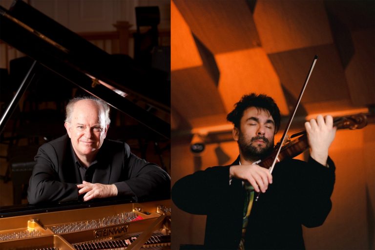 Photo showing musicians Julian Jacobson seated at a piano and Bogdan Vacarescu playing a violin